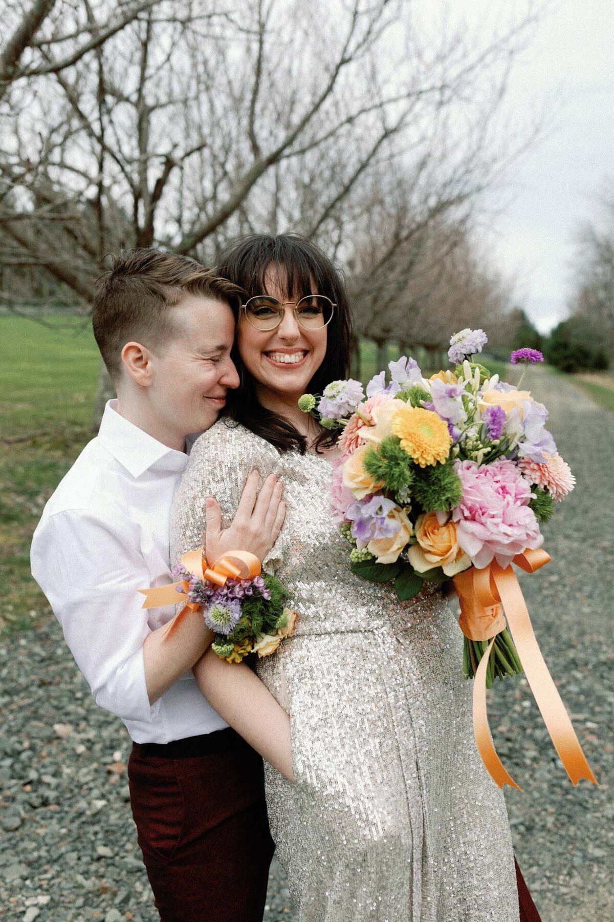 winter CT wedding with sequin jumpsuit and bouquet corsage by little sister creative