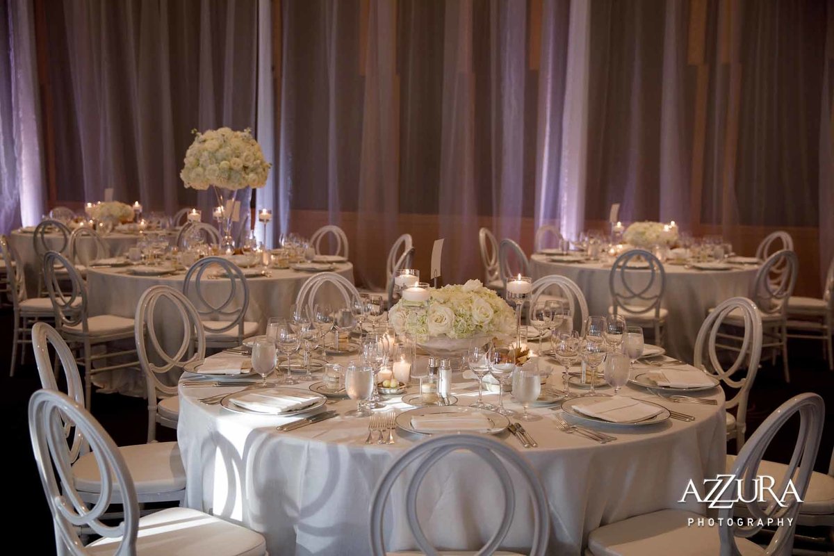 round wedding reception tables dressed in white at Four Seasons Seattle