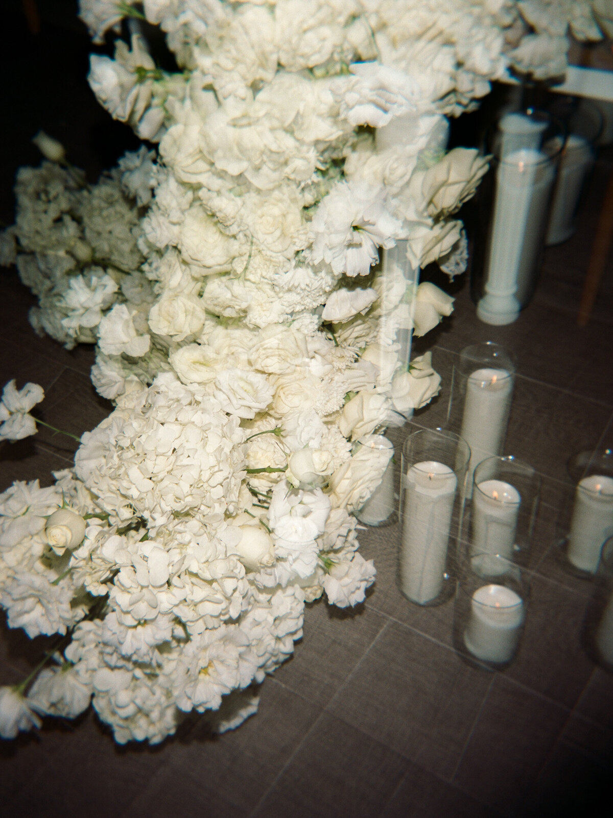 film wedding photographer in Mexico, lush white flowers, floral installation, Mexico wedding