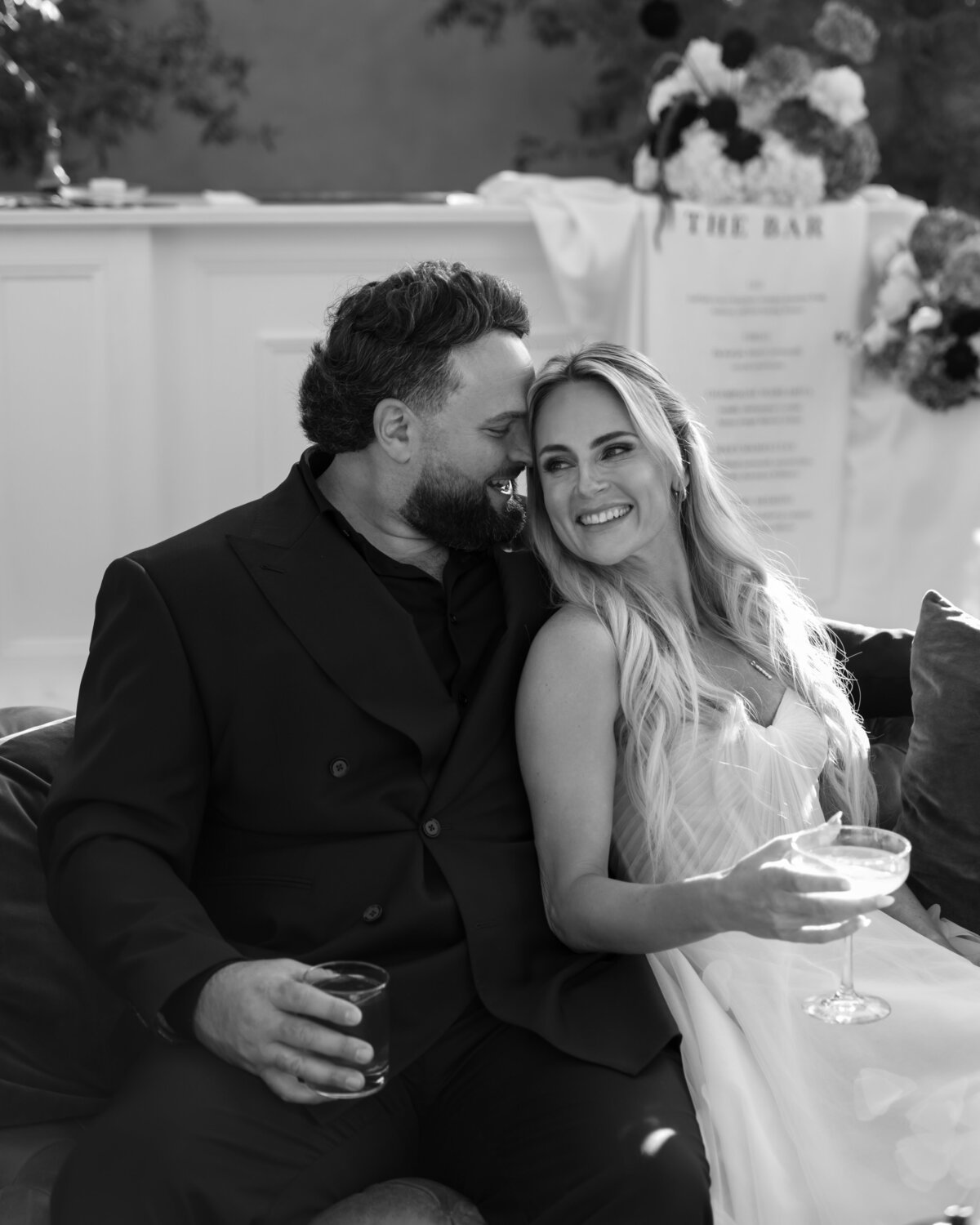 close up of bride and groom laughing 