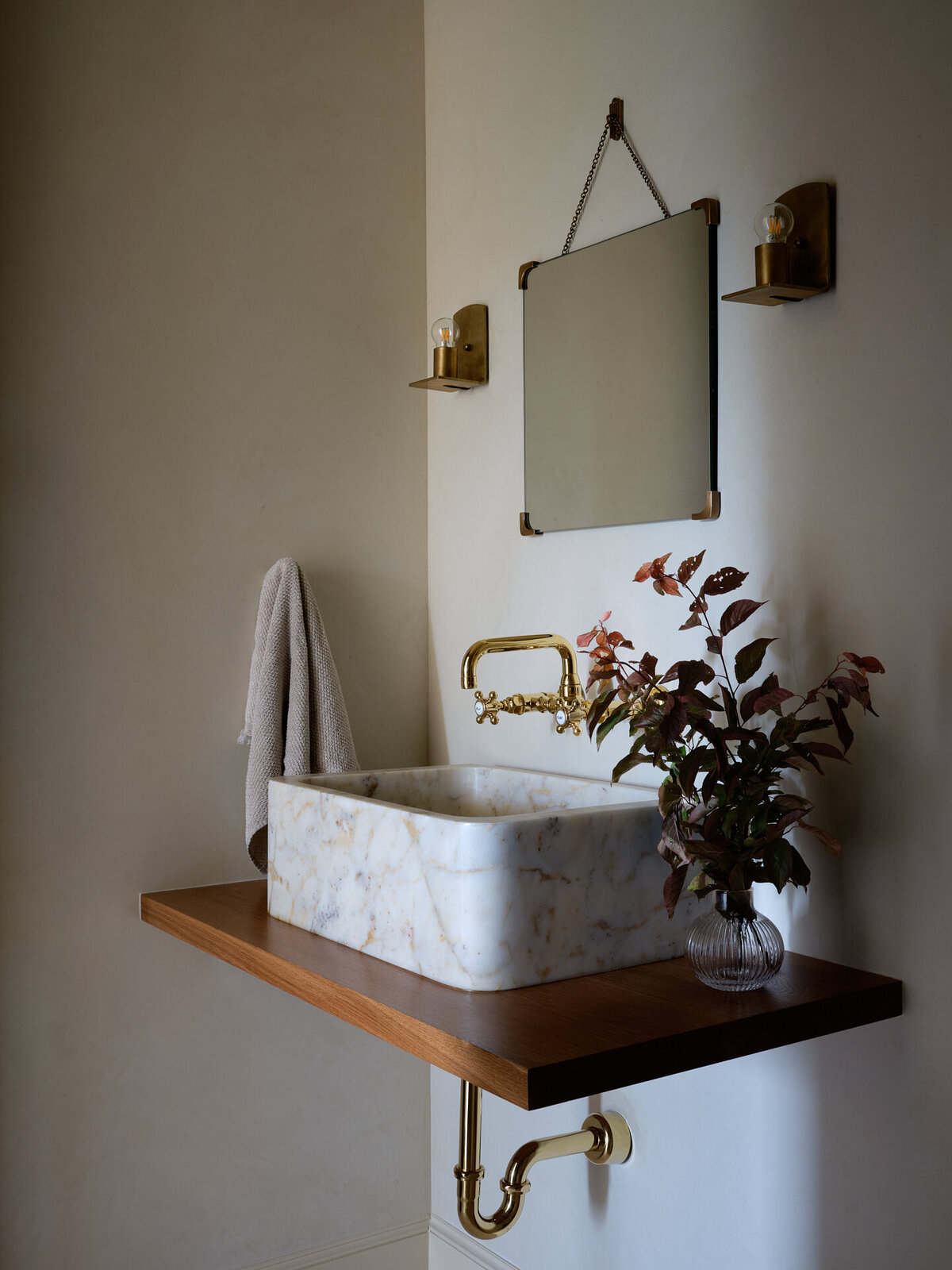 house-franc-hillside-hideaway-bathroom-remodel-renovation-jamie-sigler-home-plaster-walls-marble-vessel-sink-rohl-faucet-burgundy-florals-nickey-kehoe-sconce-moody-interiors-austin-texas