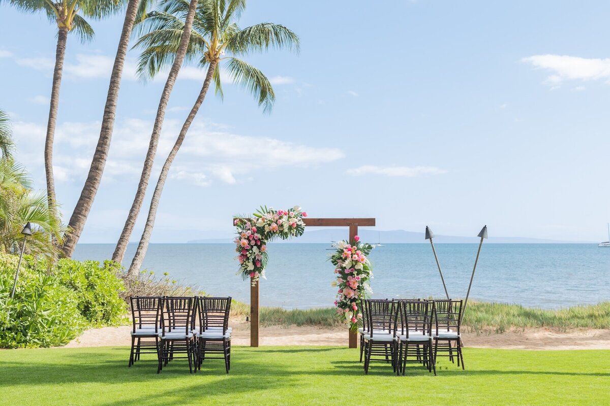 Maui Wedding Photography of wedding arch and chairs beach side