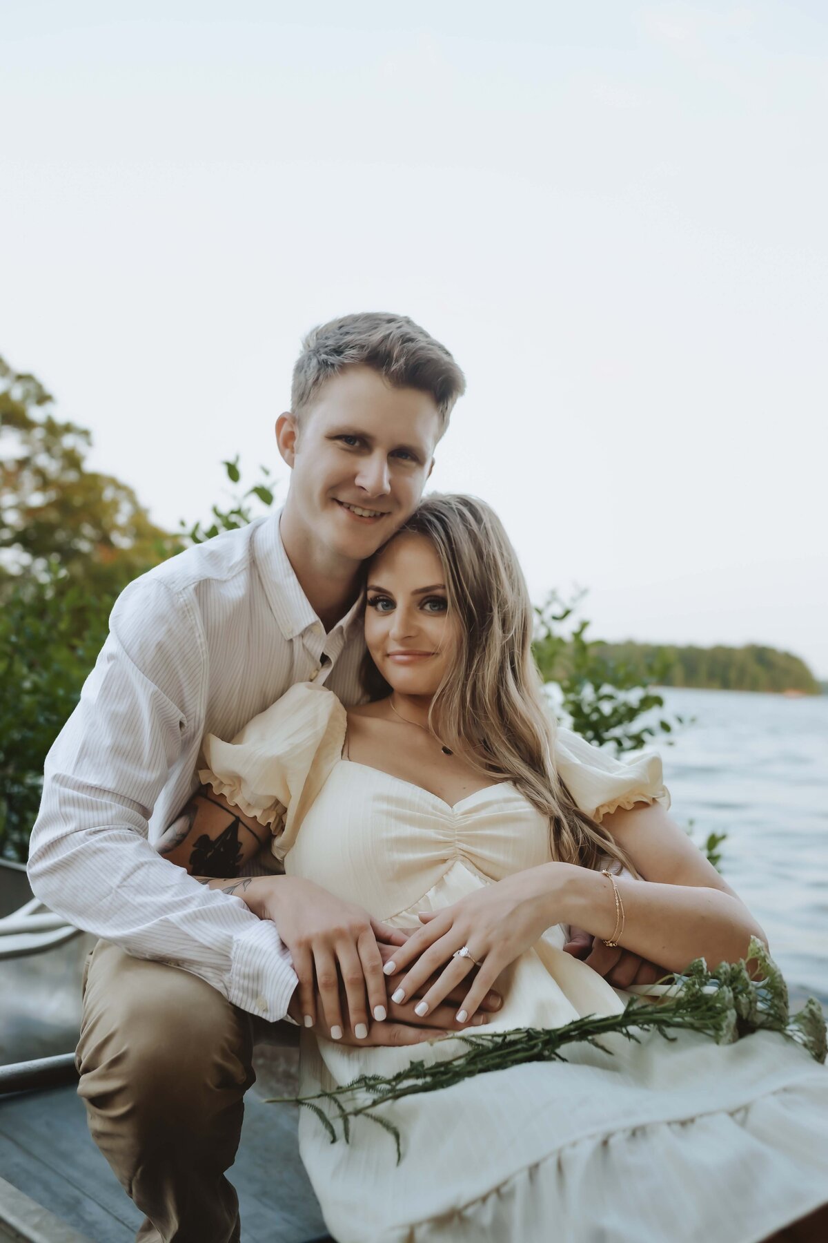 Couple celebrates engagement with romantic canoe ride at lake in Springfield Missouri