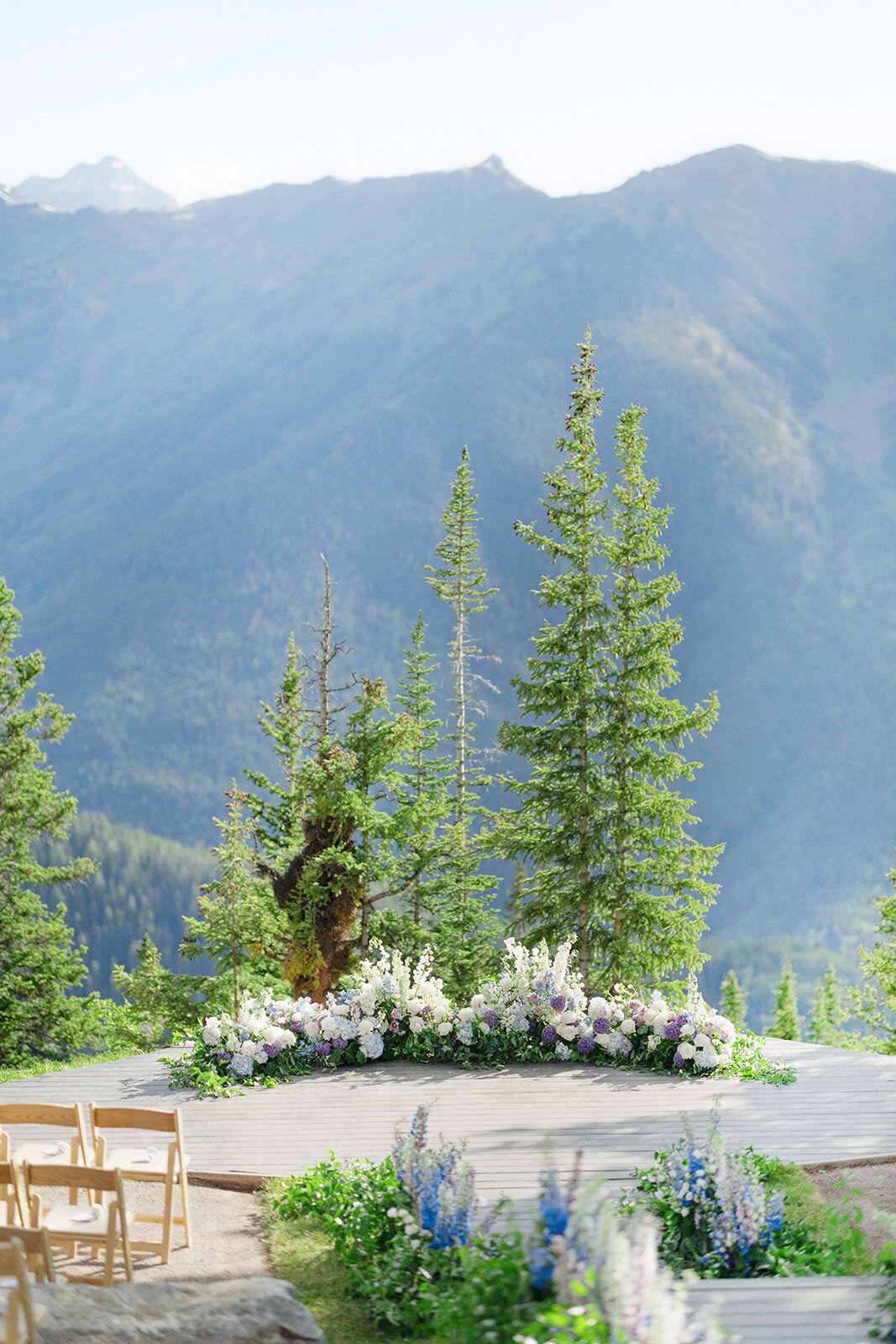 wedding-ceremony-deck-with-flowers-aspen-HBICWeddings