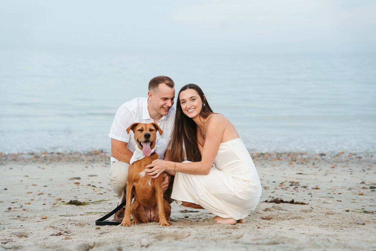 Duxbury MA engagement session featuring natural beach portraits and moments with the couple’s pup.