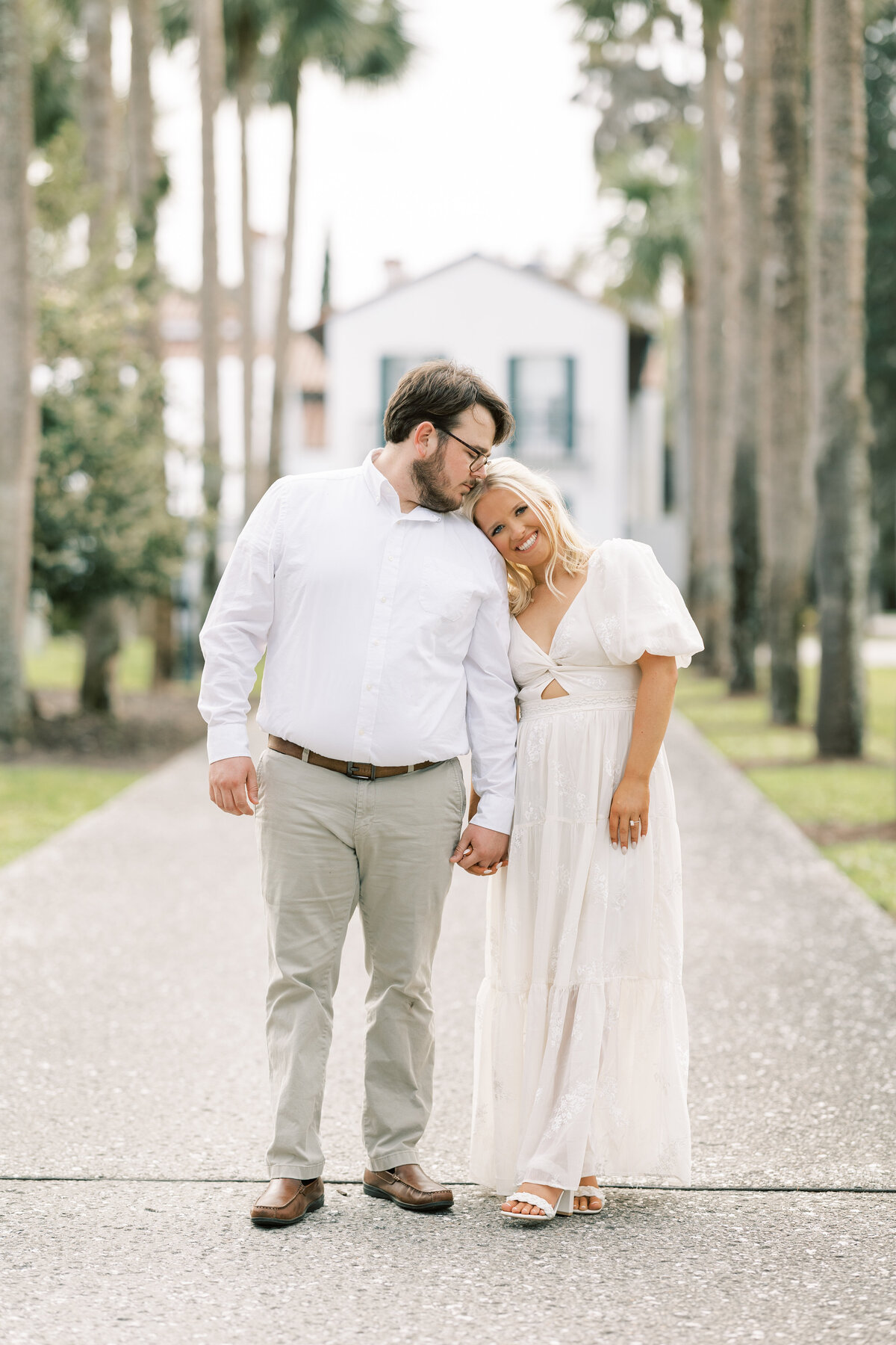 engaged woman leaning her head on her fiance's shoulder
