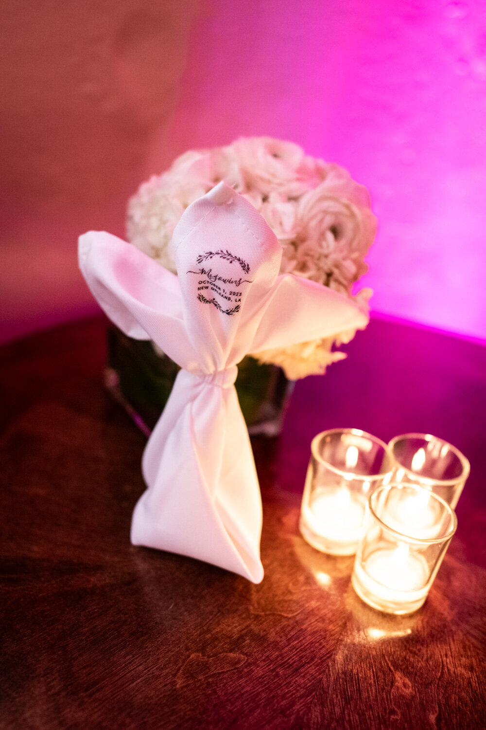 Candles, bouquet, and napkin on table at Latrobe's reception