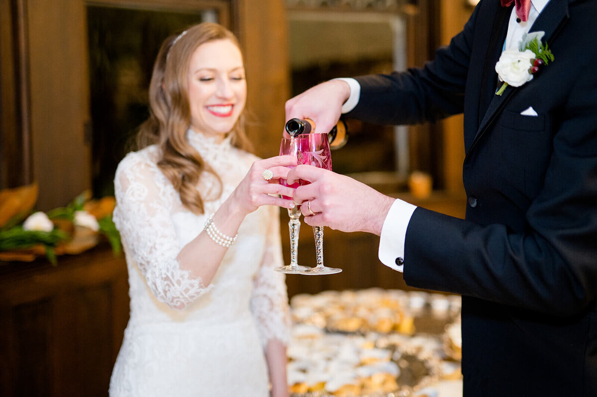 couple-toasting-red-glasses