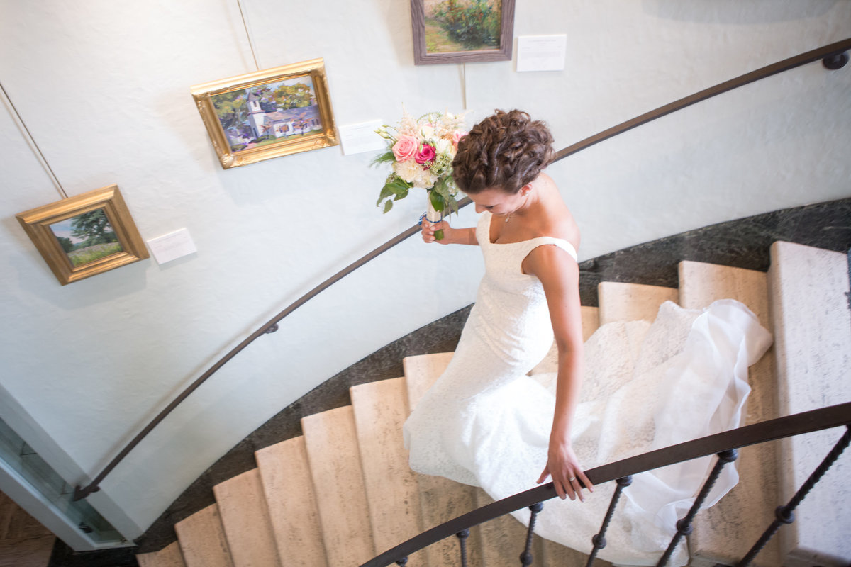 bride on staircase at the GreenAcres Arts Center in Cincinnati