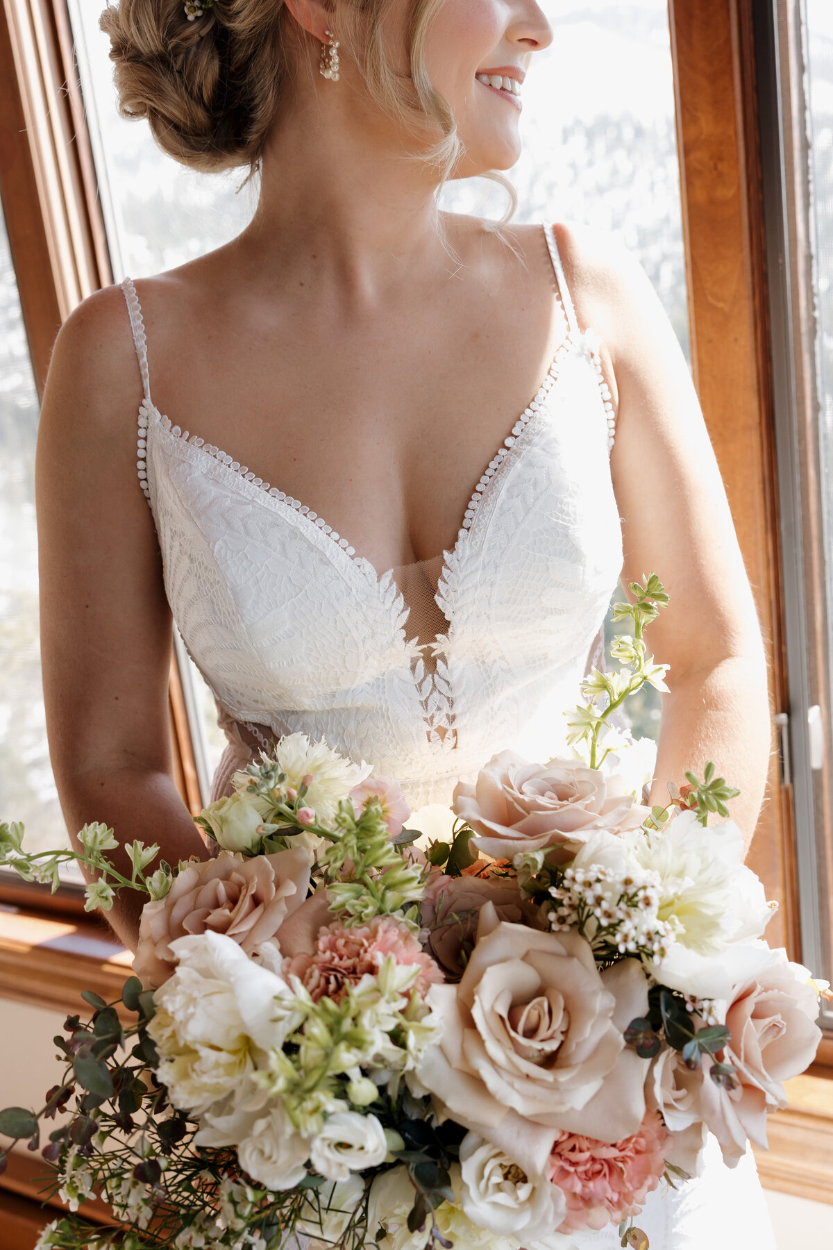 Newlyweds laughing together at their South Lake Tahoe wedding, surrounded by the beauty of Tahoe Blue Estate.