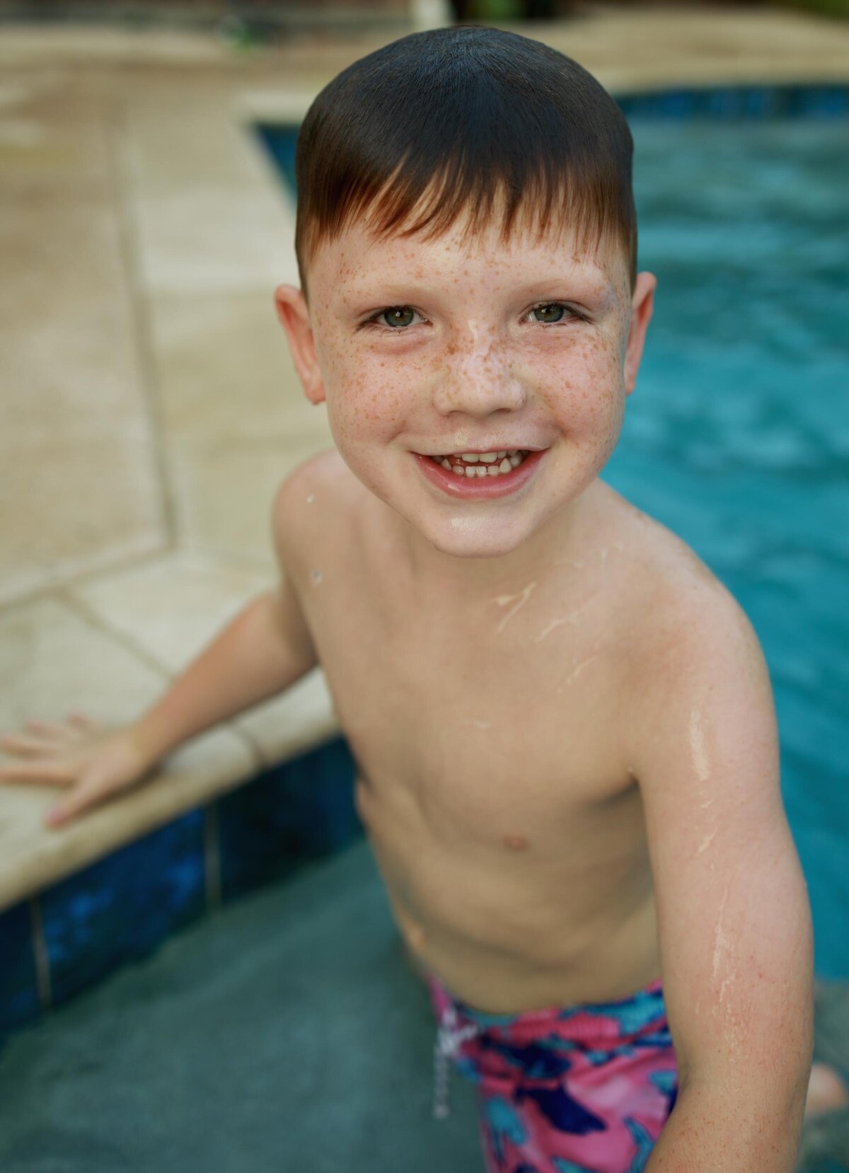 a boy plays in the pool in dallas texas
