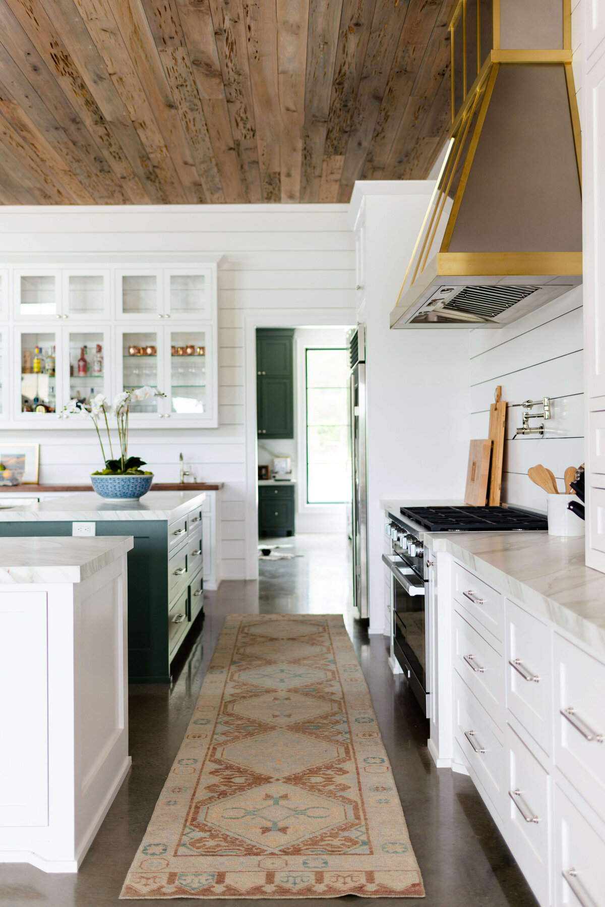 oyster creek studios building belt new build white kitchen with shiplap ceiling and runner rug