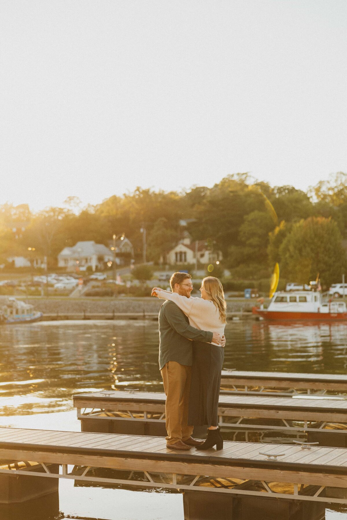couple embracing on boat dock