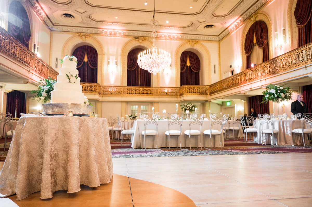 wedding cake and tables at reception