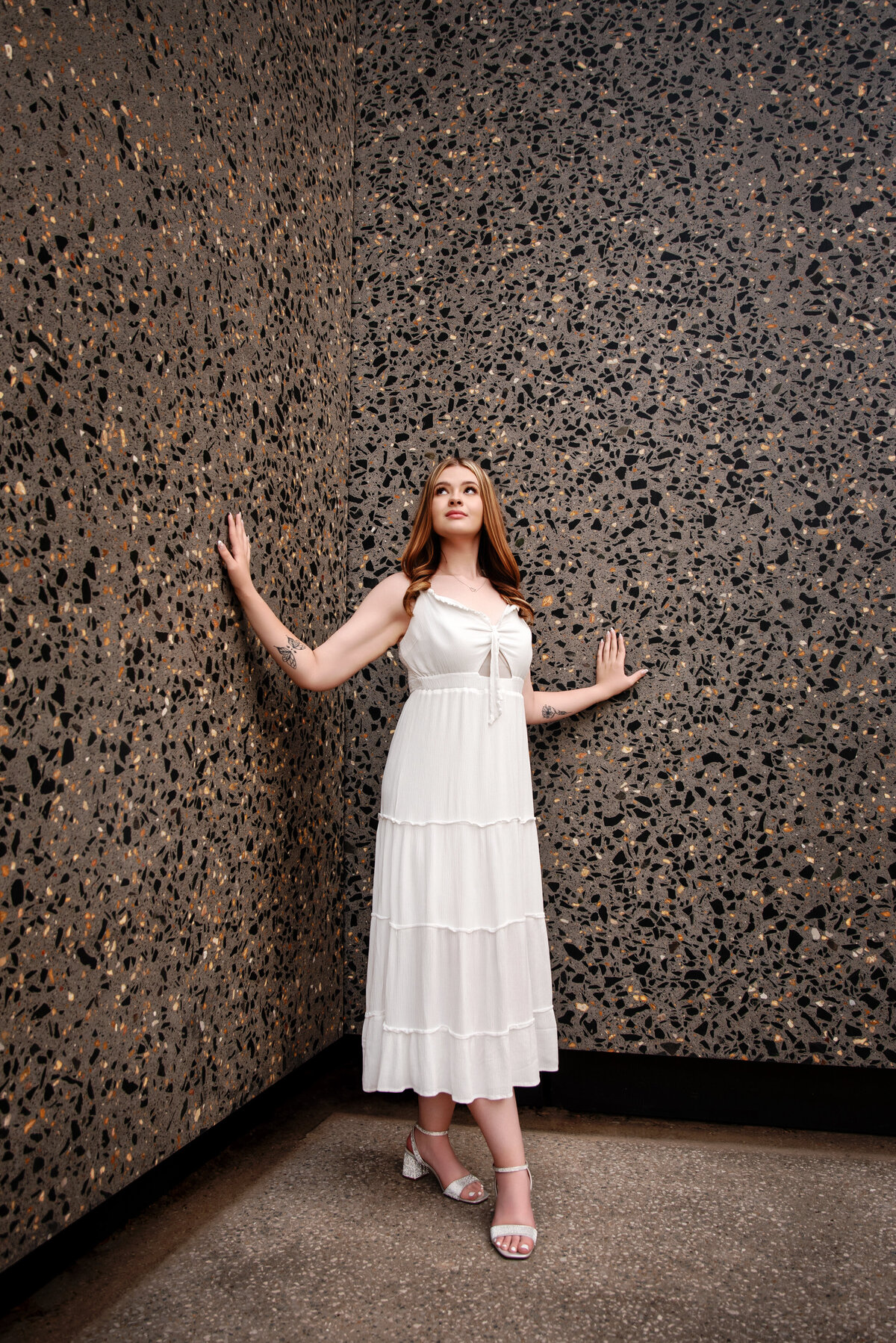 st-louis-senior-photographer-senior-girl-in-white-dress-with-marble-wall