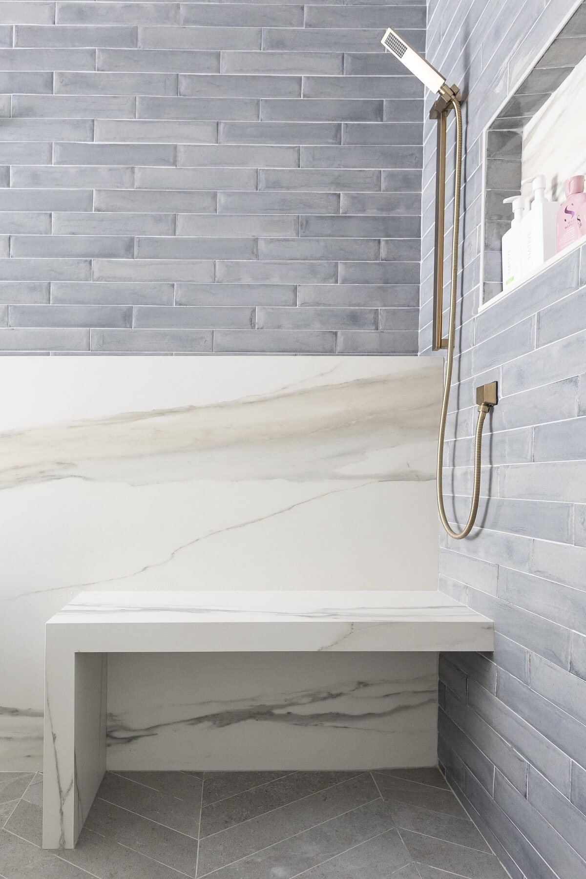 dewine design orlando interior designer contemporary coastal primary bathroom shower with marble and blue tile