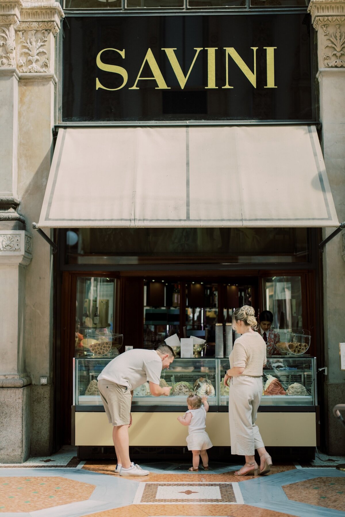 Family selecting gelato together on a quiet Italian street, a candid moment of joy and connection
