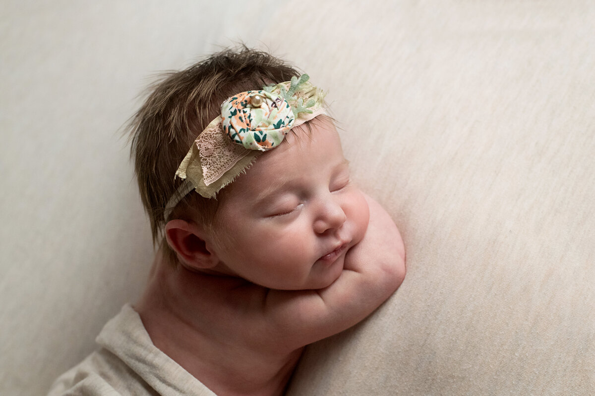 baby girl sleeping on her belly