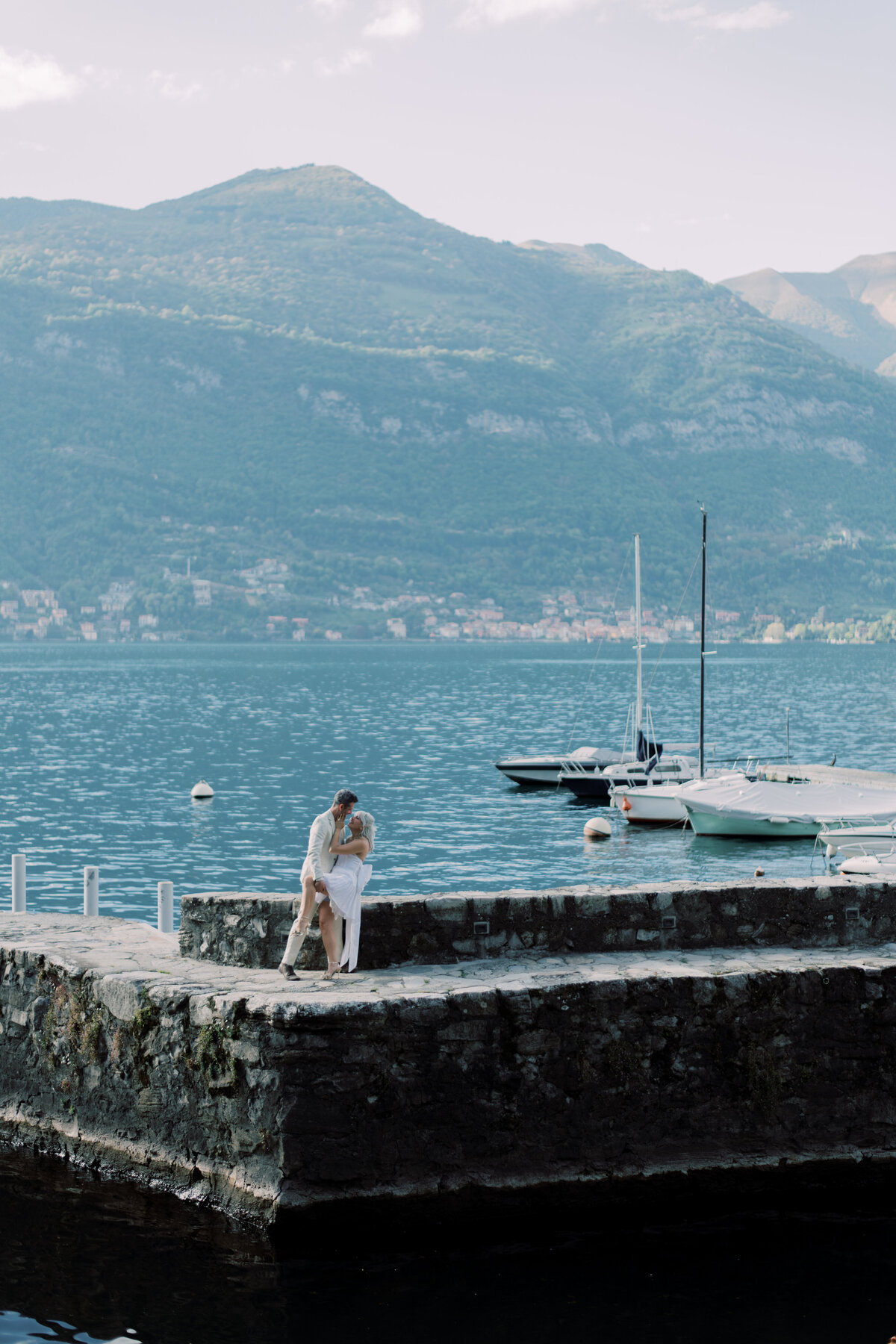 A serene view of Lake Como’s iconic waterfront buildings, adding a sense of timeless elegance to the engagement session.