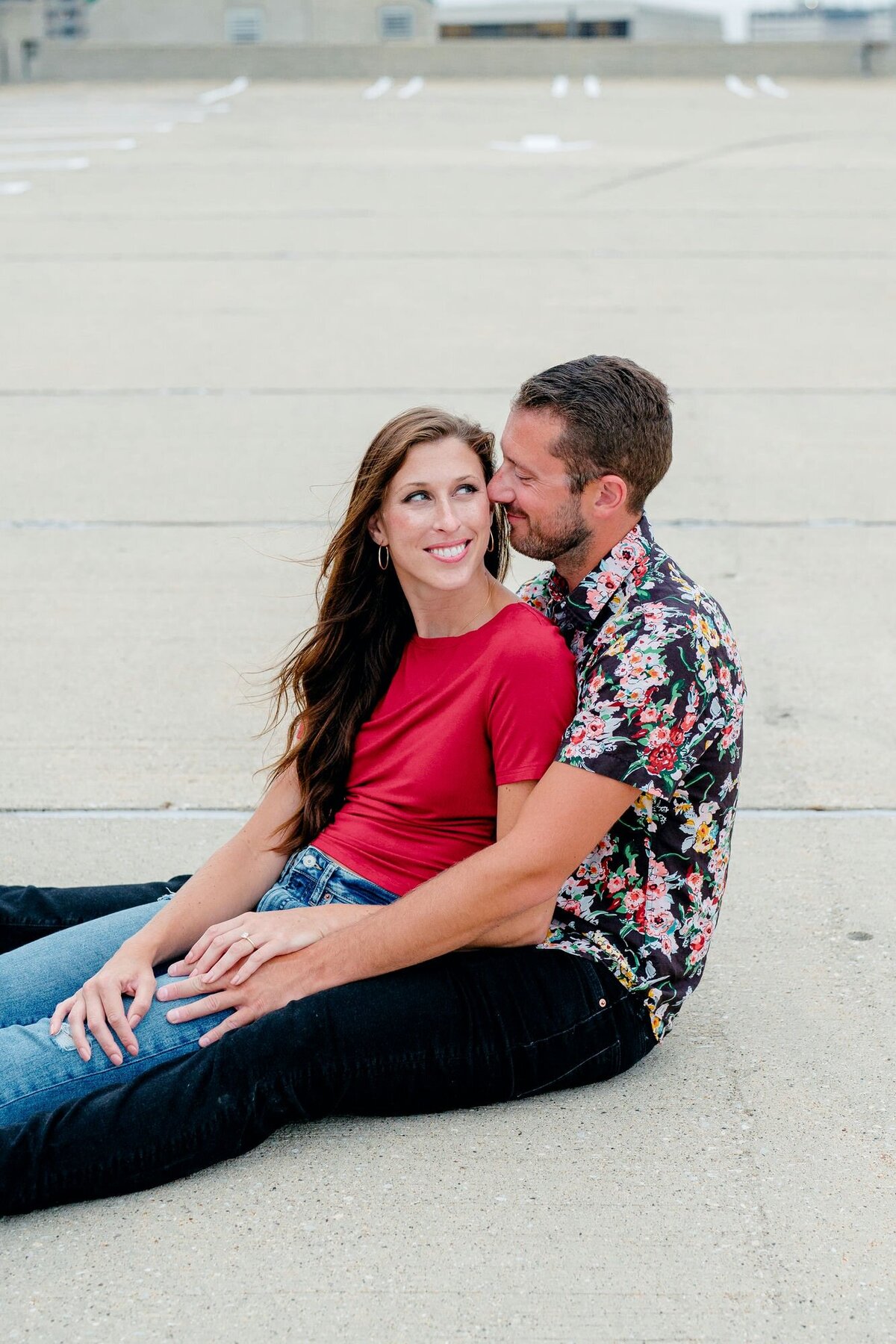 couple-sitting-embrace-closeup-urban-engagement