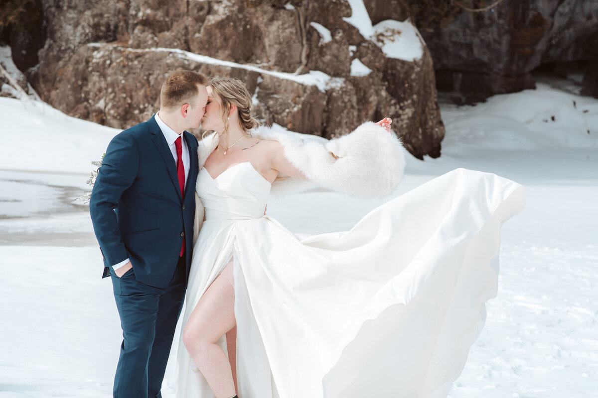 couple kissing on the snow