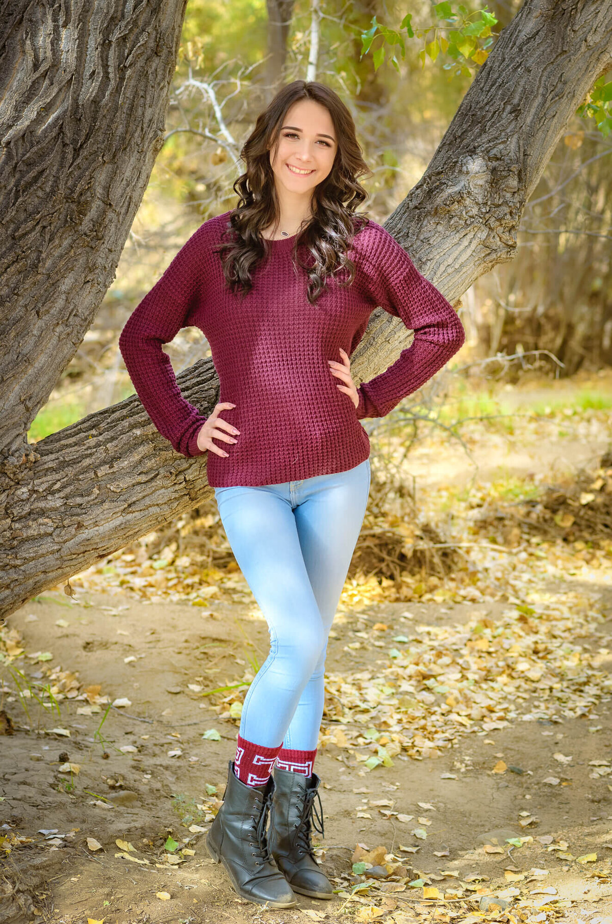 Girl poses in Prescott senior photos during fall with Melissa Byrne