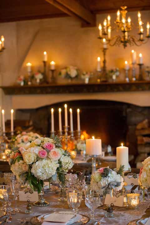 engagement party for Bachelorette Desiree at Chateau Lill with romantic hydrangea and rose compote arrangements with candelabras in front of fireplace