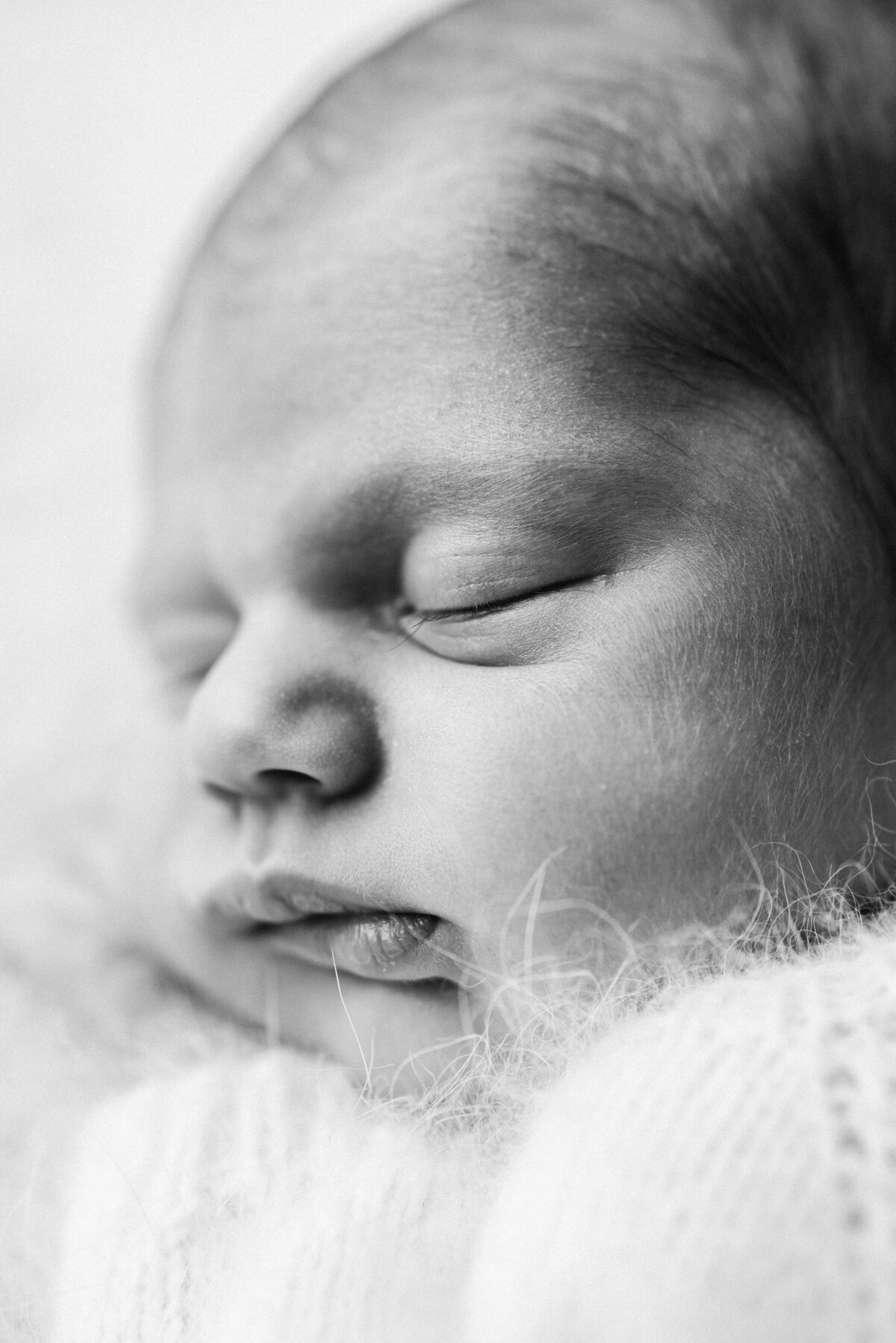 Baby girl sleeping at a newborn photoshoot in billingshurst