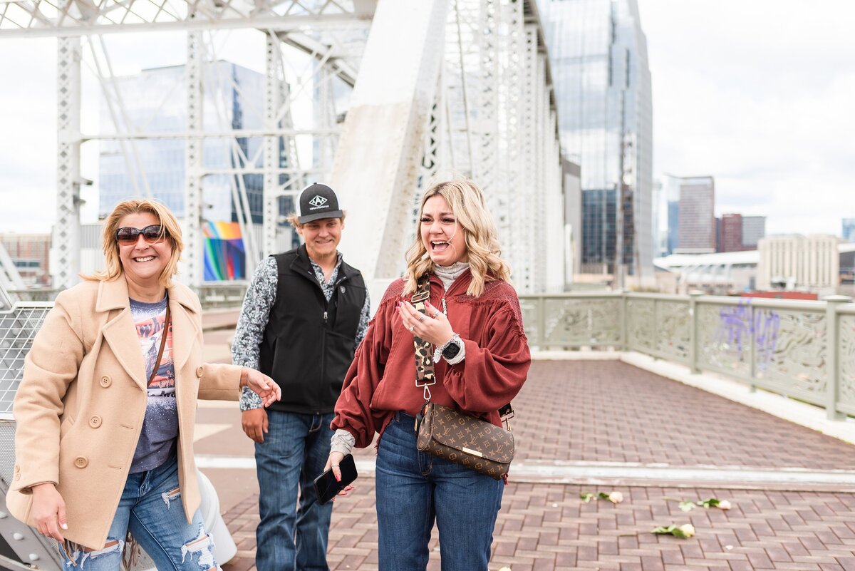 Surprise-proposal-photos-in-Downtown-Nashville-Pedestrian-Bridge+20