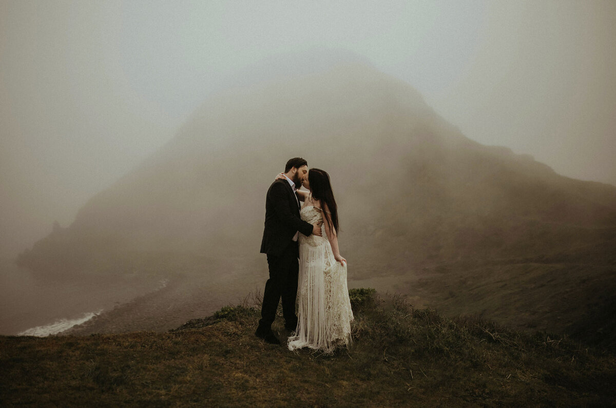 An eloping couple kissing at Sisters Rock State Park, Oregon.