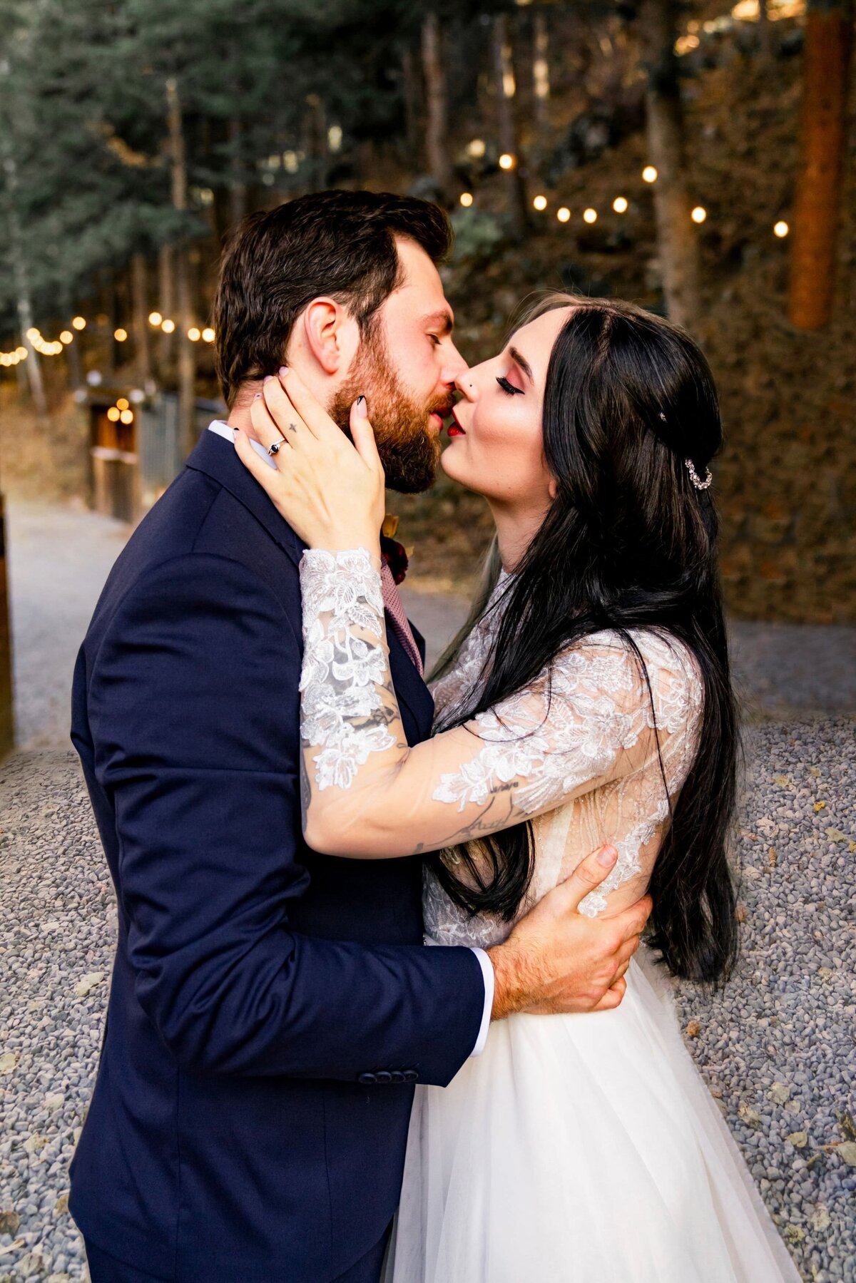 *denver colorado wedding photographer - couple kissing by lights
