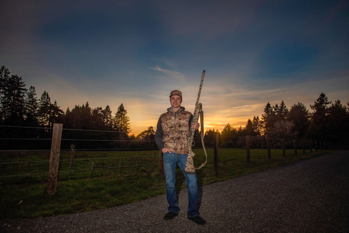 Humboldt-county-senior-photographer-boys-senior-photographer-camo-gun-sunset