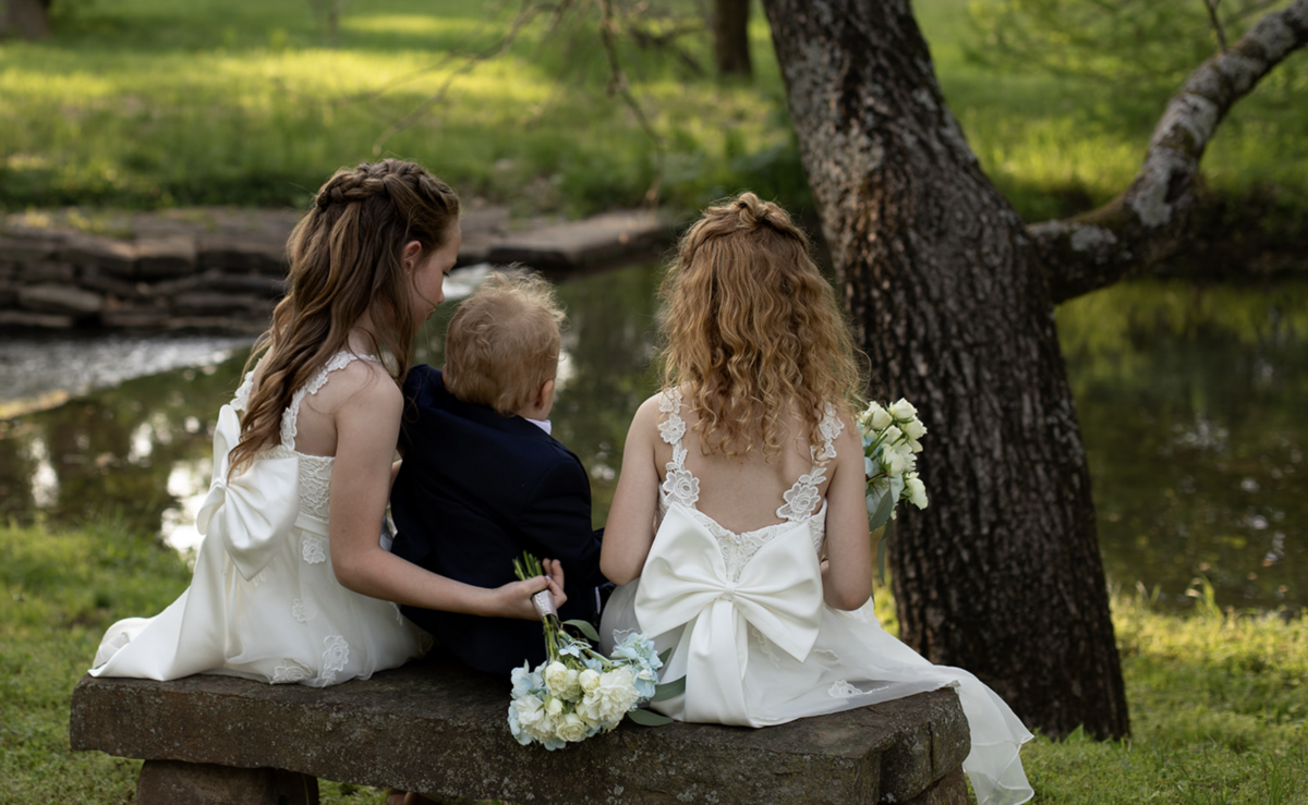 flower-girls-and-ring-bearer-by-pond-wedding-photography