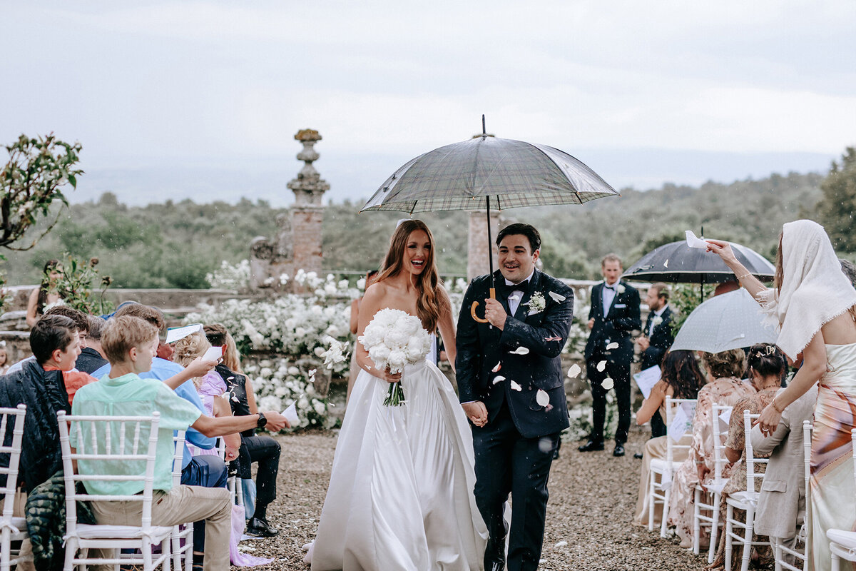 Bride and groom walking down the aisle in Tuscany