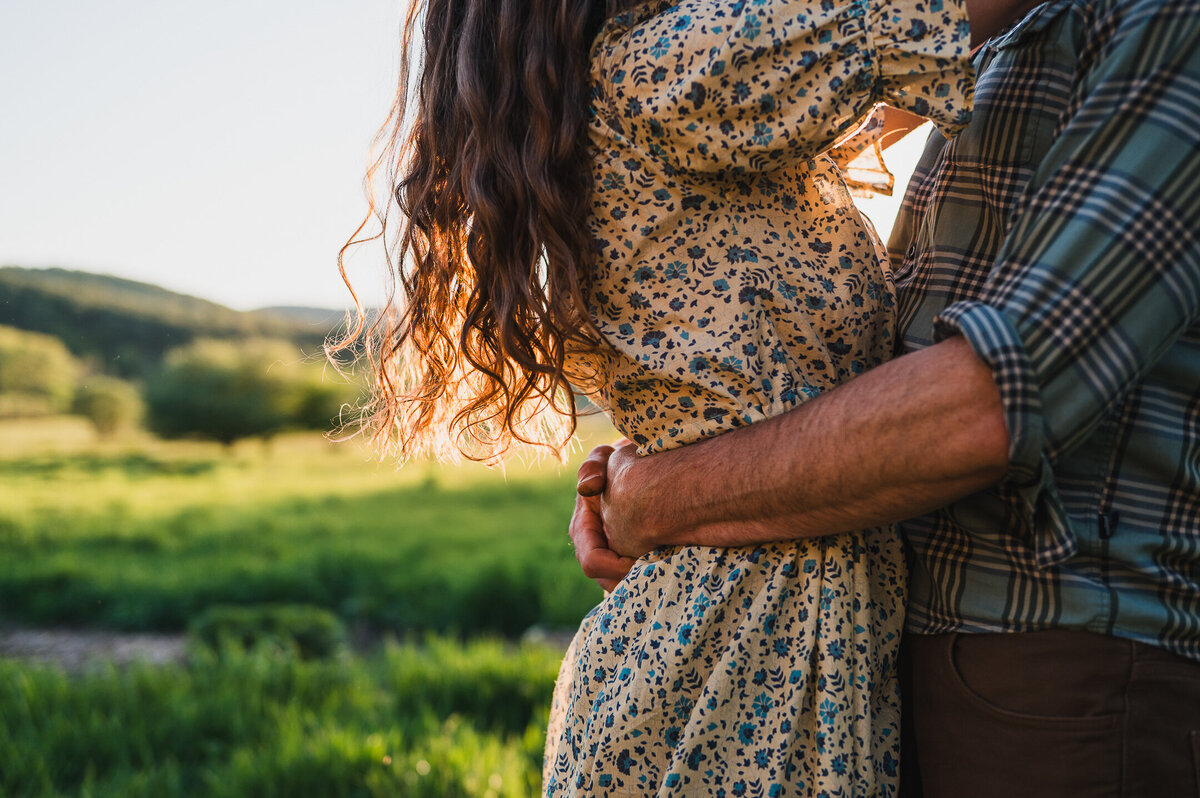 Golden hour embrace between a couple in the Hudson Valley, photographed in a documentary, natural style