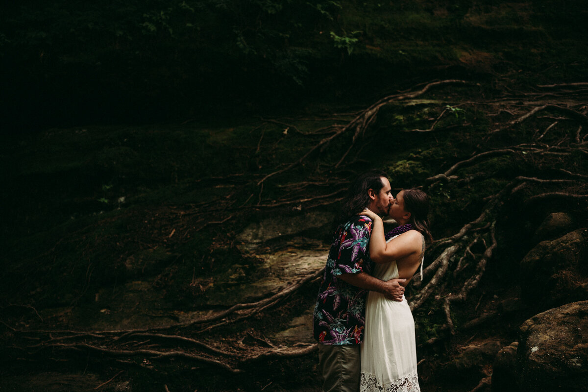 Couple embrace in woods at Ohio elopement
