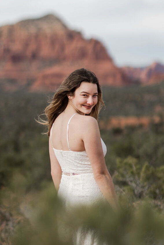 Senior girl looking back during Sedona destiation photo shoot