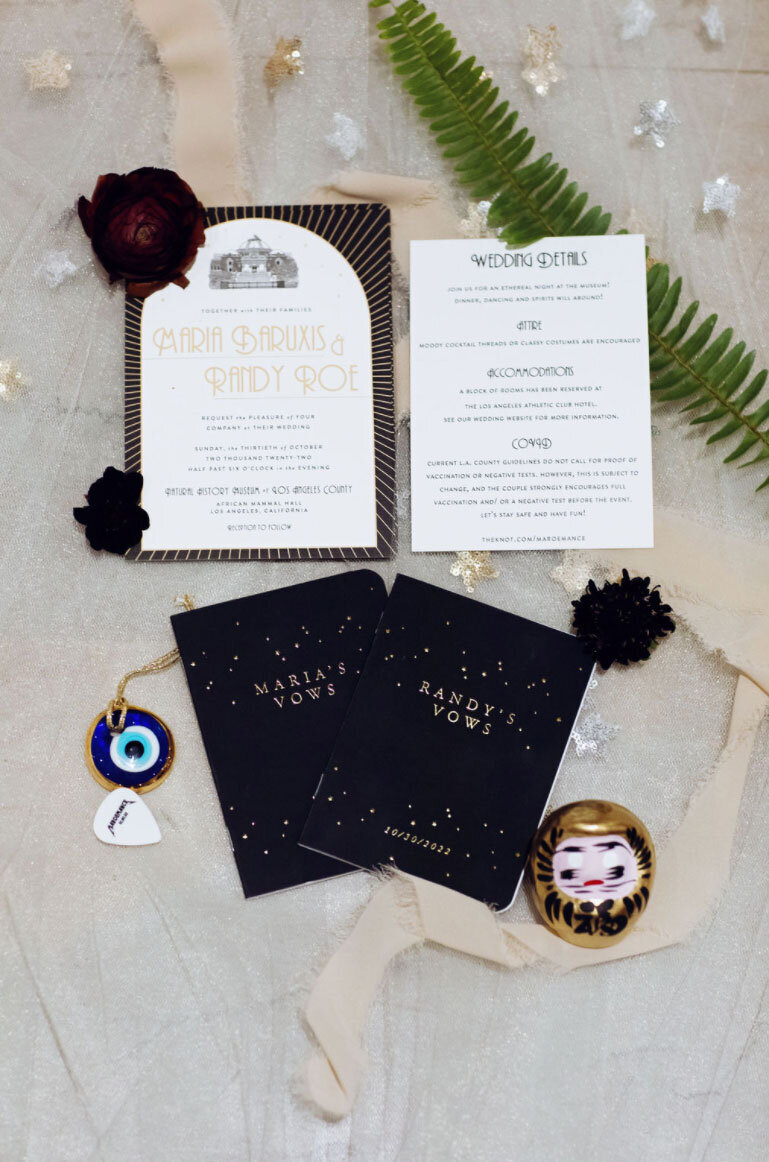 Los Angeles Museum of Natural History wedding invitation featuring sketch of building. Invitation colors are black, gold and white
