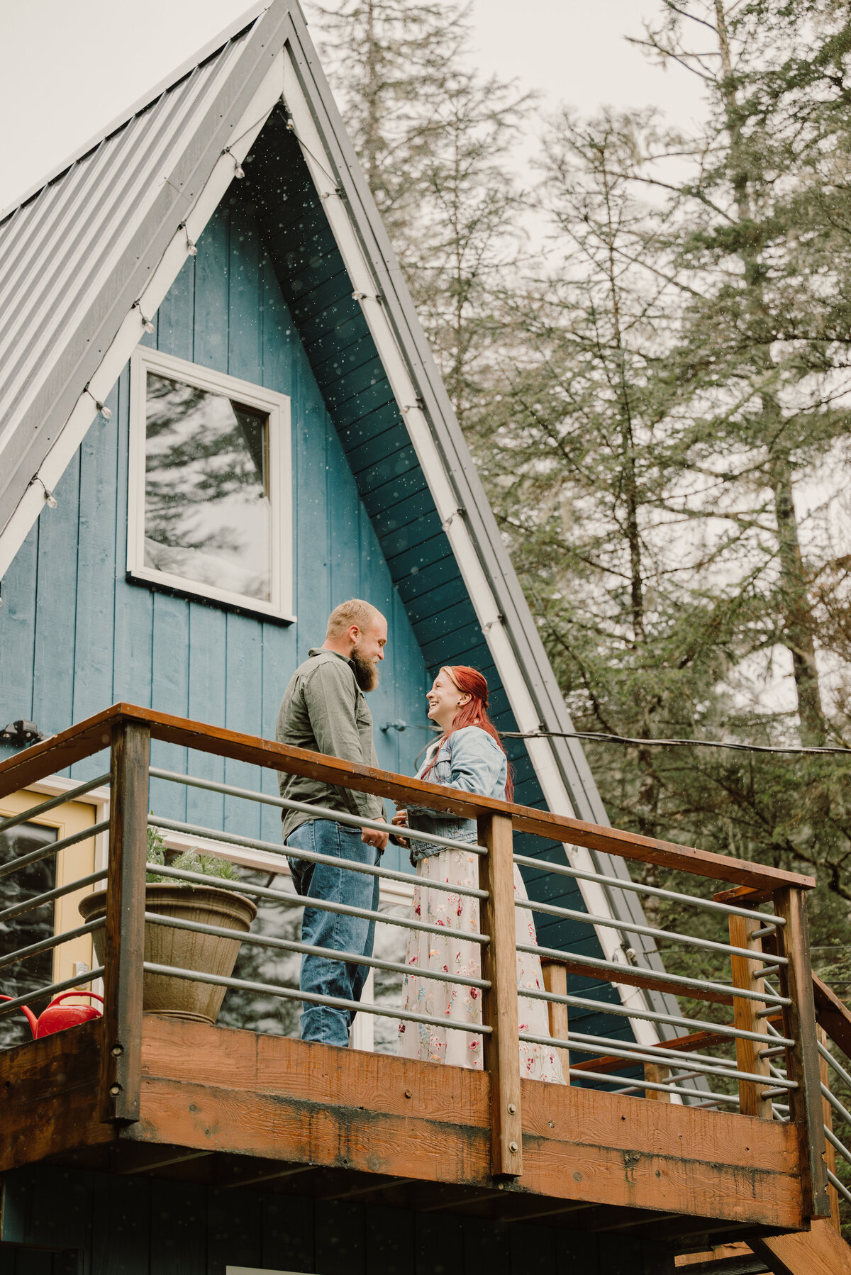 Couple hold hands and stand on the deck