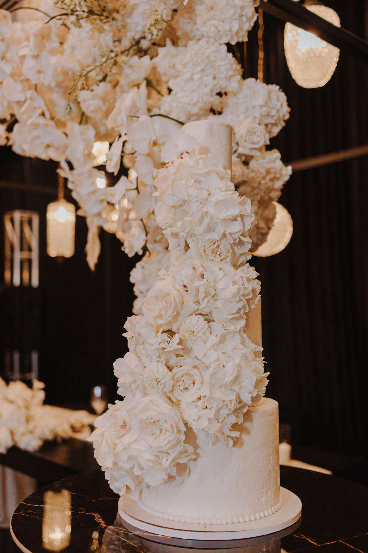 black-white-gold-wedding-reception-cake-flowers
