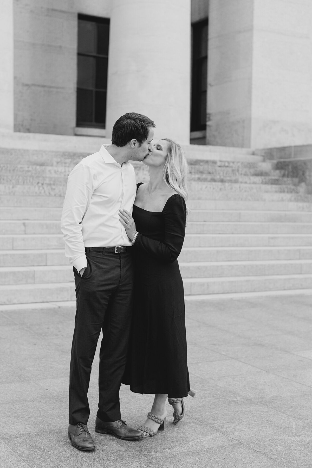 Couple kissing in front of Ohio State House posed by the best Ohio Wedding photographers