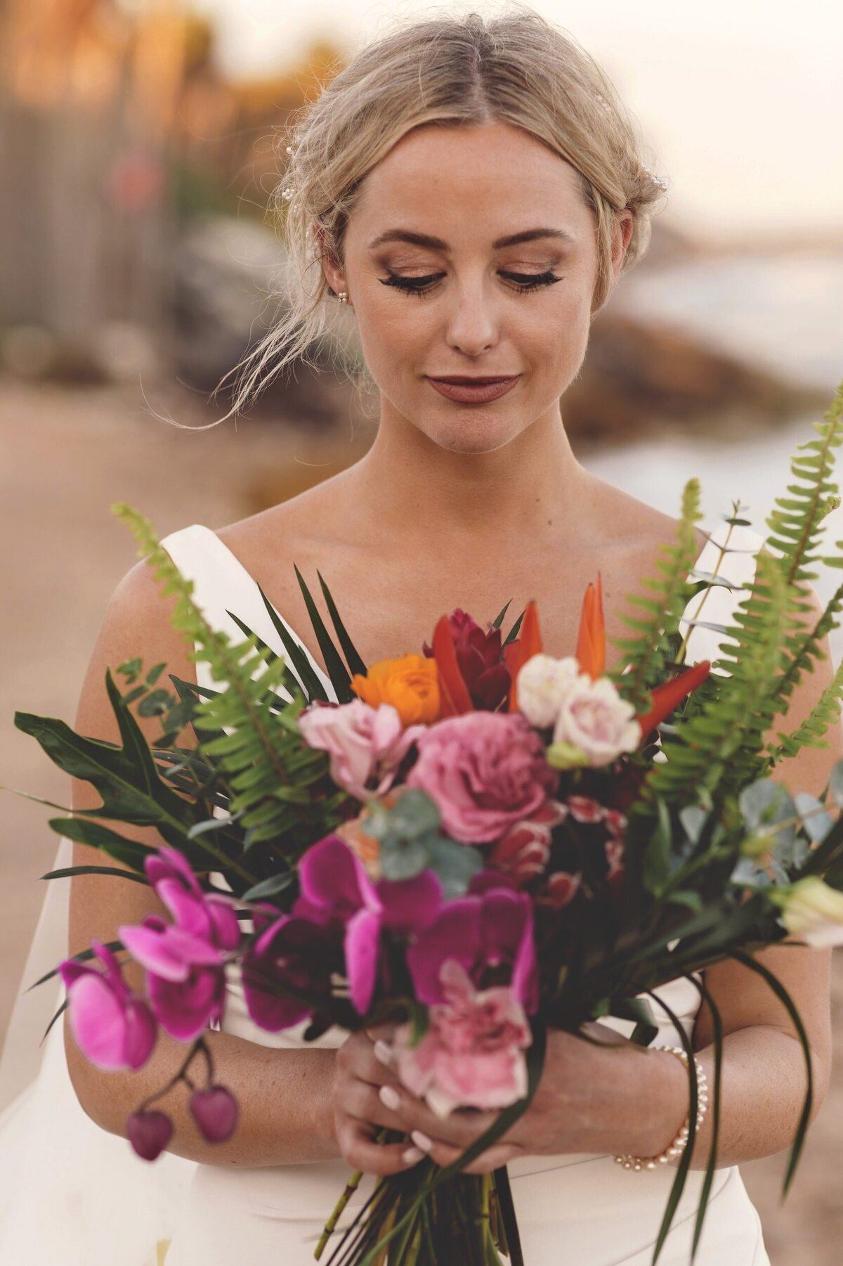 Portrait of bride with flowers at Blue Venado Seaside Riviera Maya wedding