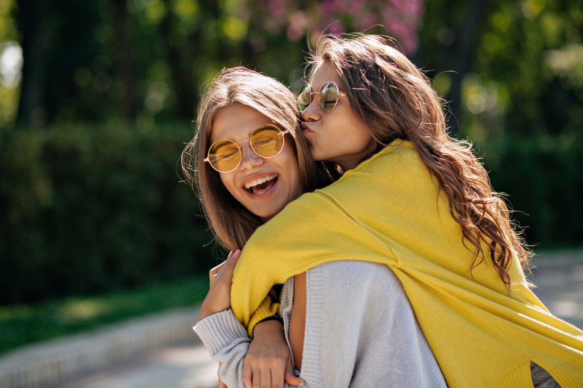 close-up-lifestyle-portrait-two-happy-inspired-teen-friends-hugs-smiling-best-female-friends-having-fun-walking-sunny-summer-park-wearing-casual-outfit