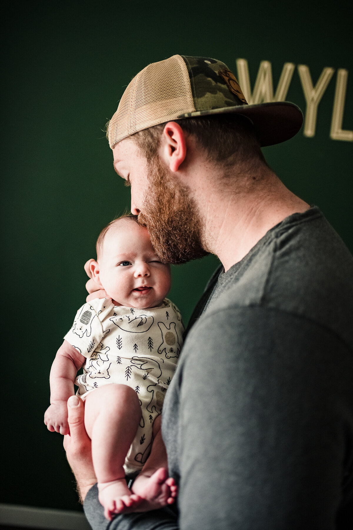 Baby being held by Dad lifestyle photography inspiration