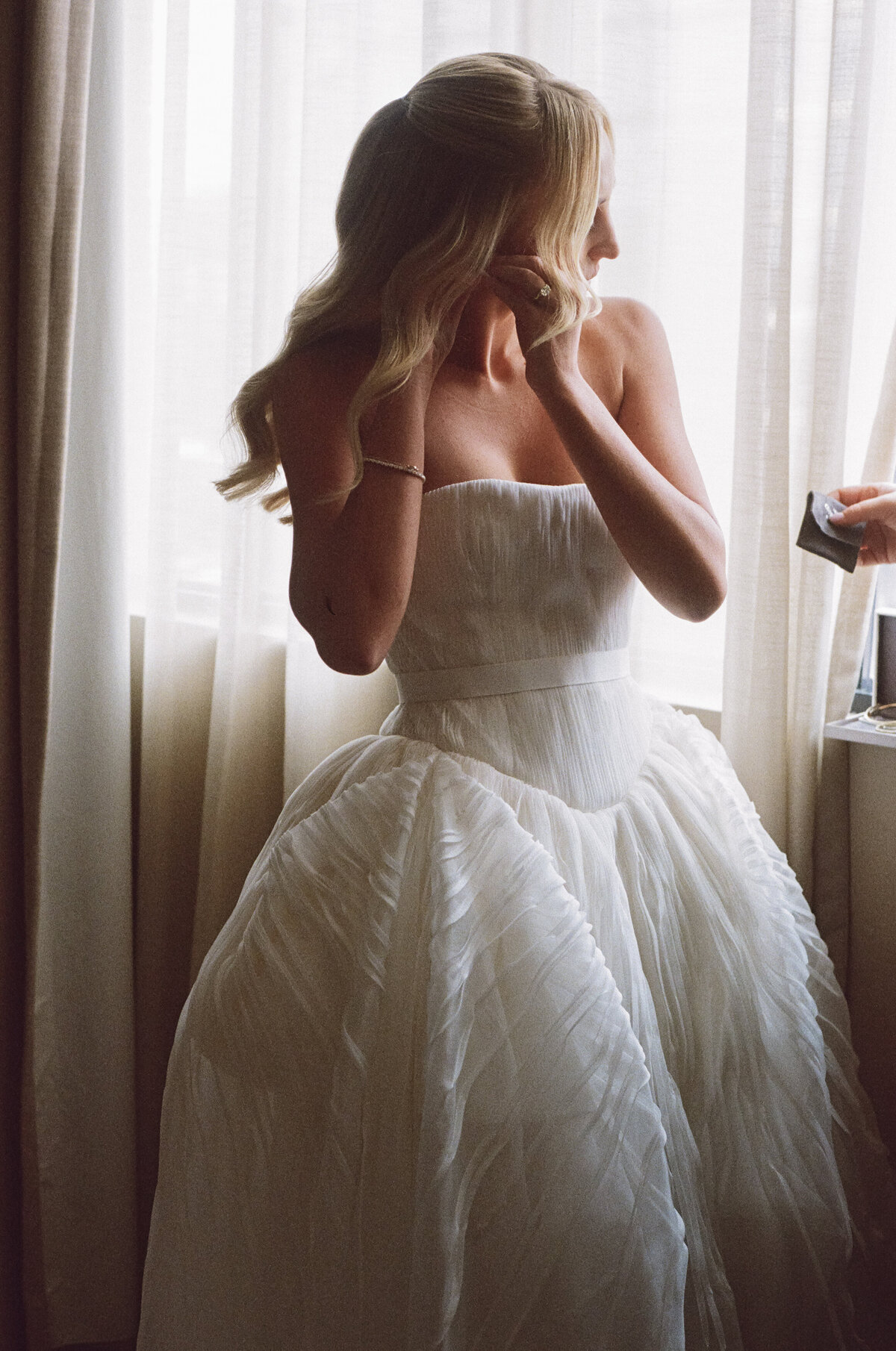 Sophisticated editorial wedding photography captures luxury bridal preparation at NOBU Hotel Chicago, featuring fashion forward styling and Lauren Alatriste's magazine-worthy approach combining editorial excellence with authentic wedding day emotion.