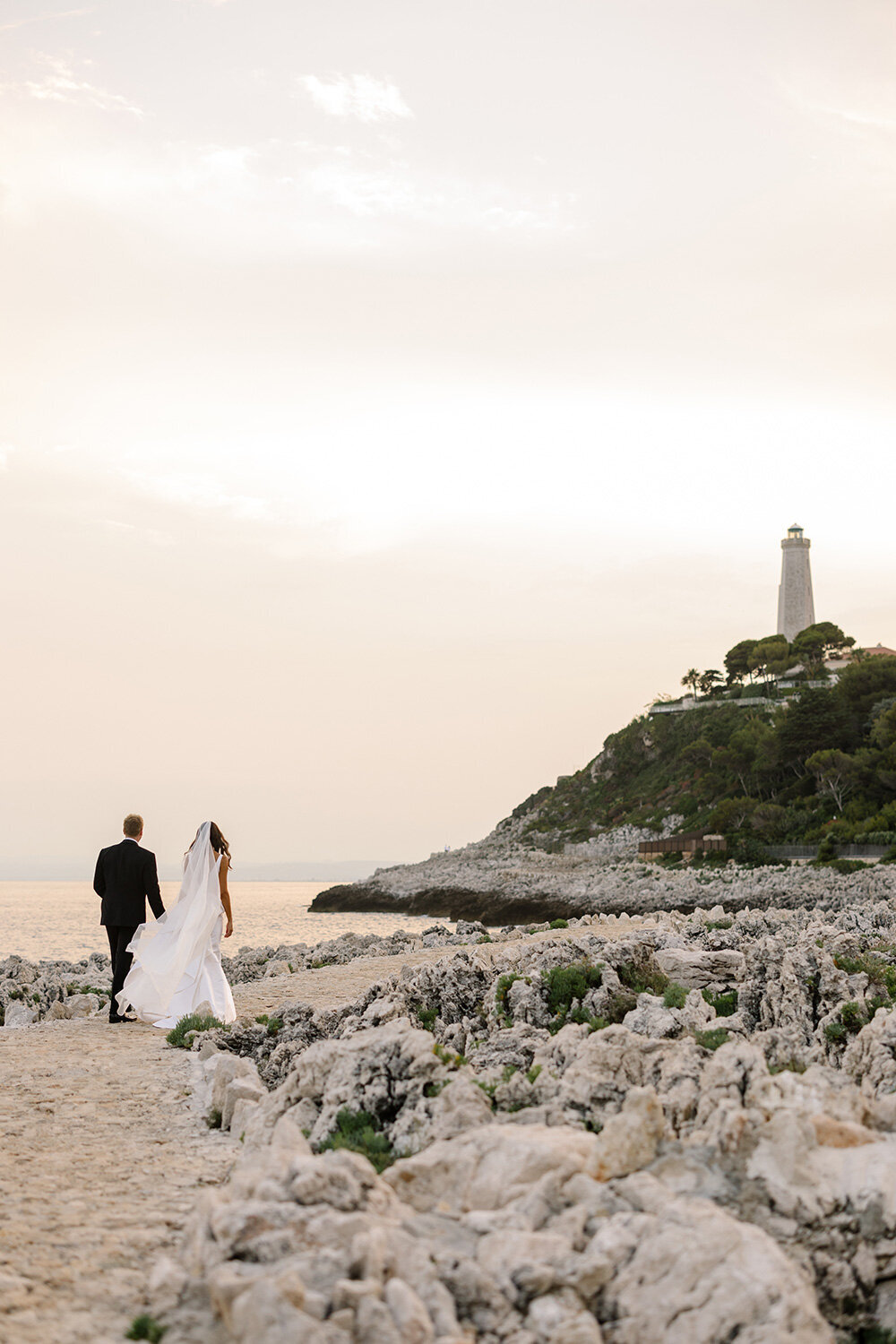 wedding couple walking at cap ferrat lighthouse