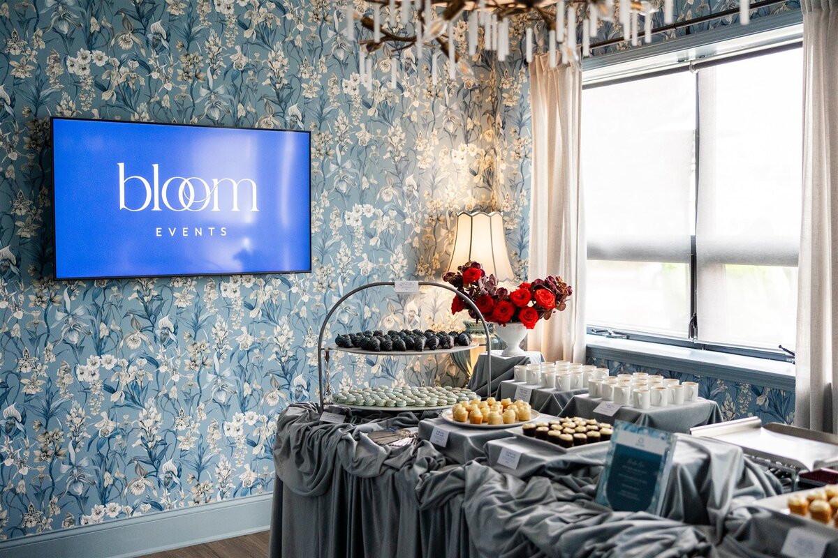 Bridal suite repurposed as a sweets station, with elegant displays of desserts on vintage furniture, soft lighting, and bridal-themed decor creating a charming and whimsical atmosphere