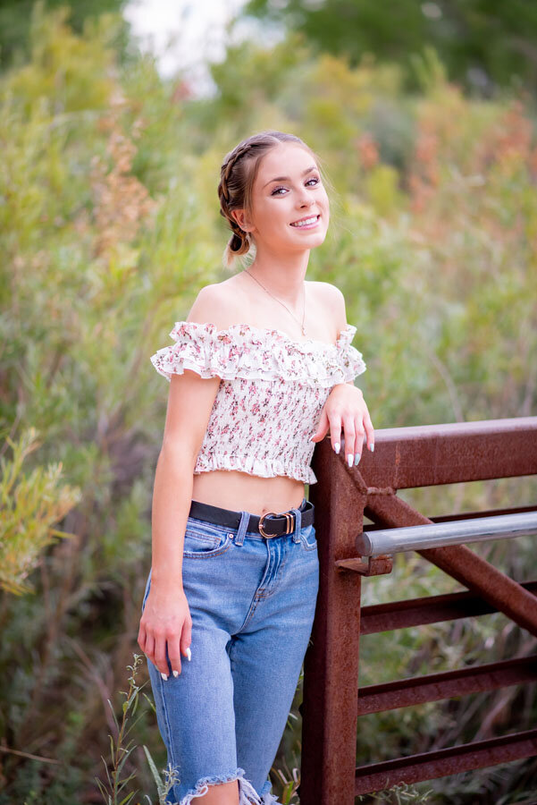 girl-high-school-senior-posing-on-bridge-cherry-creek