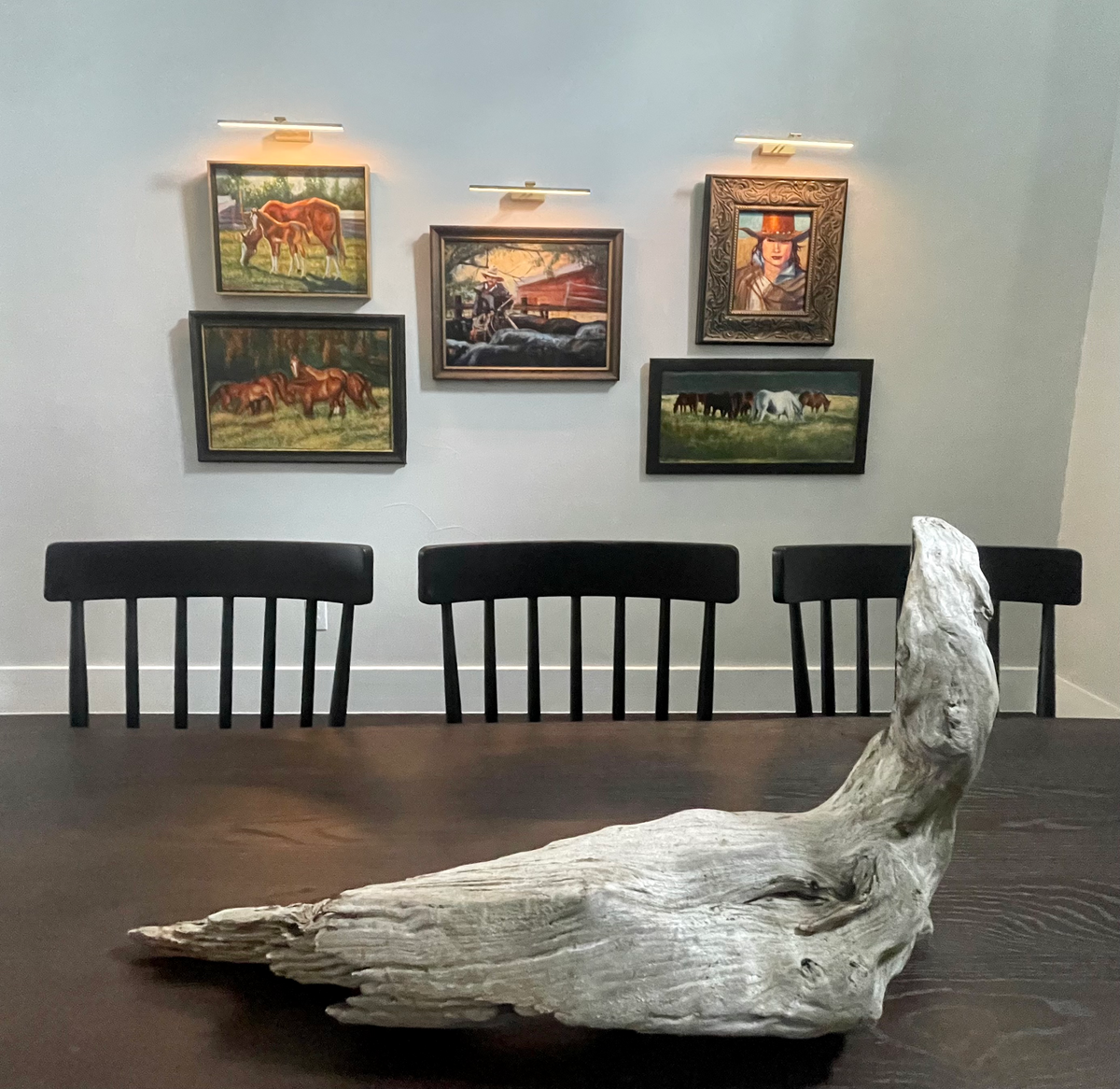 wooden table and gallery wall