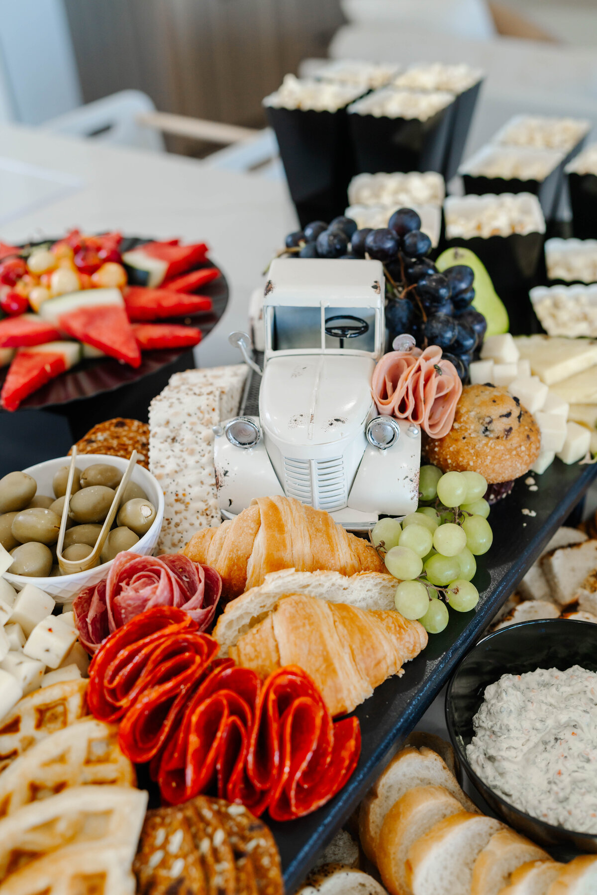 charcuterie spread with white vintage truck